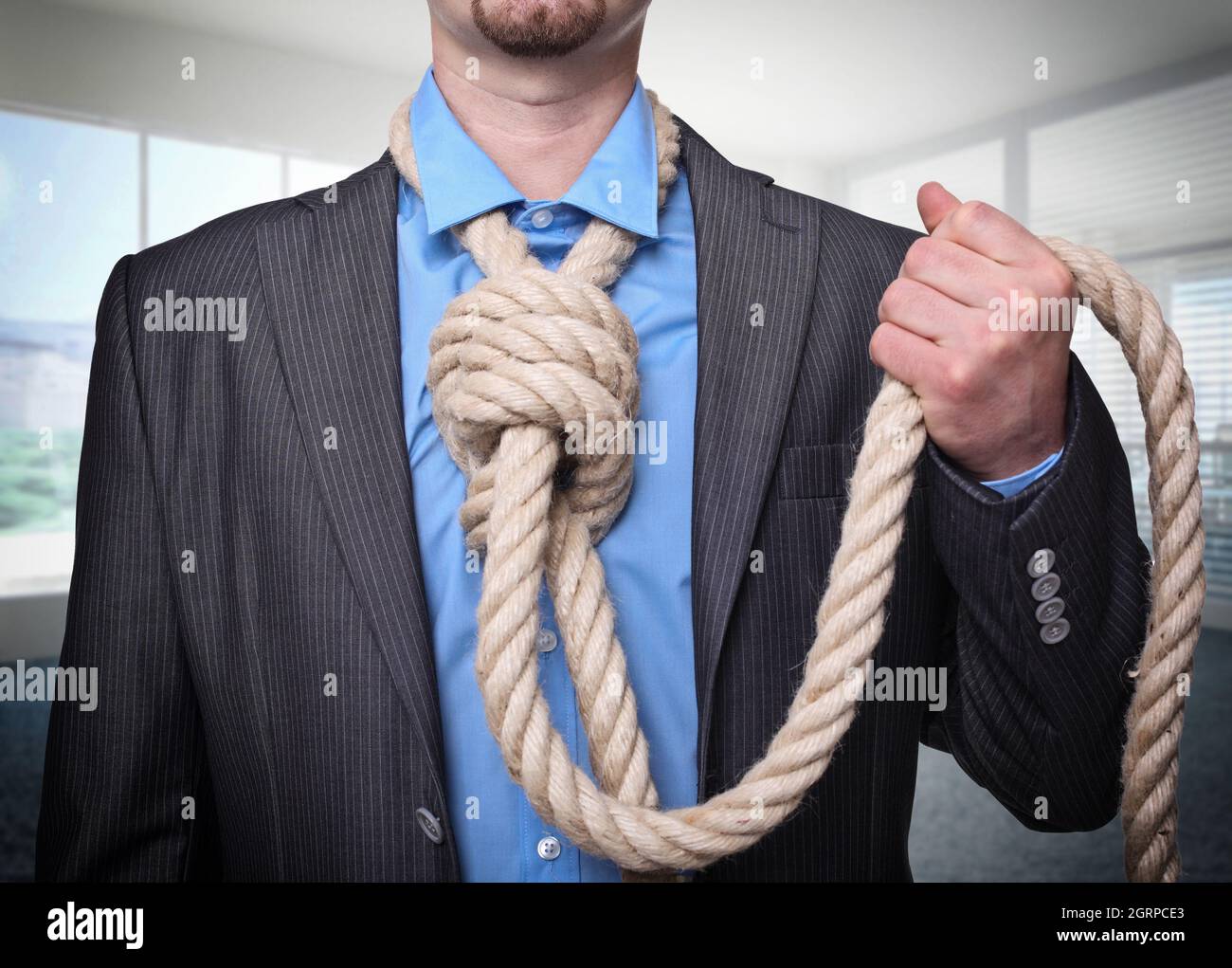 Midsection Of Businessman Standing With Rope Tied Around Neck Stock