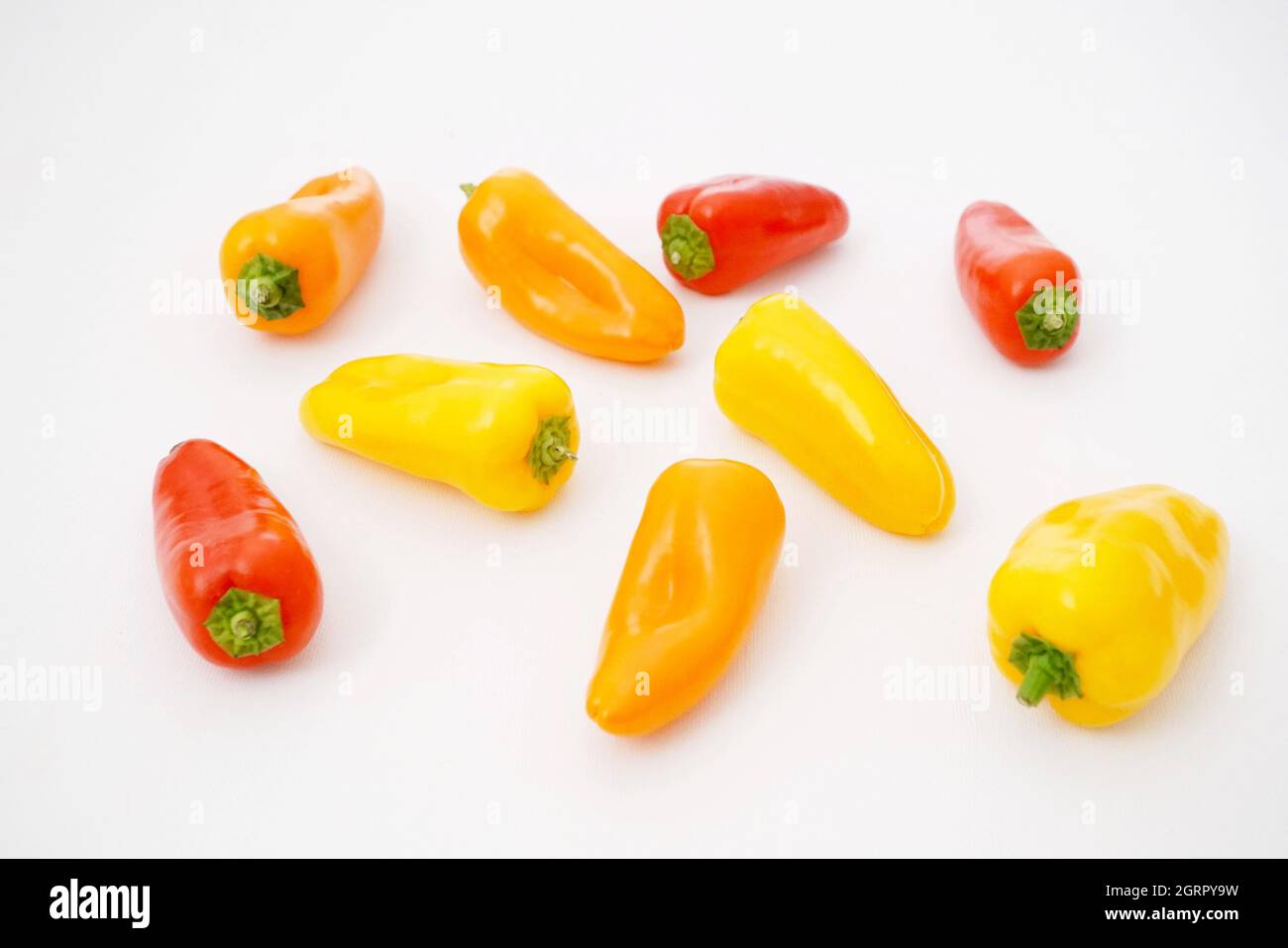 High Angle View Of Chili Peppers Against White Background Stock Photo