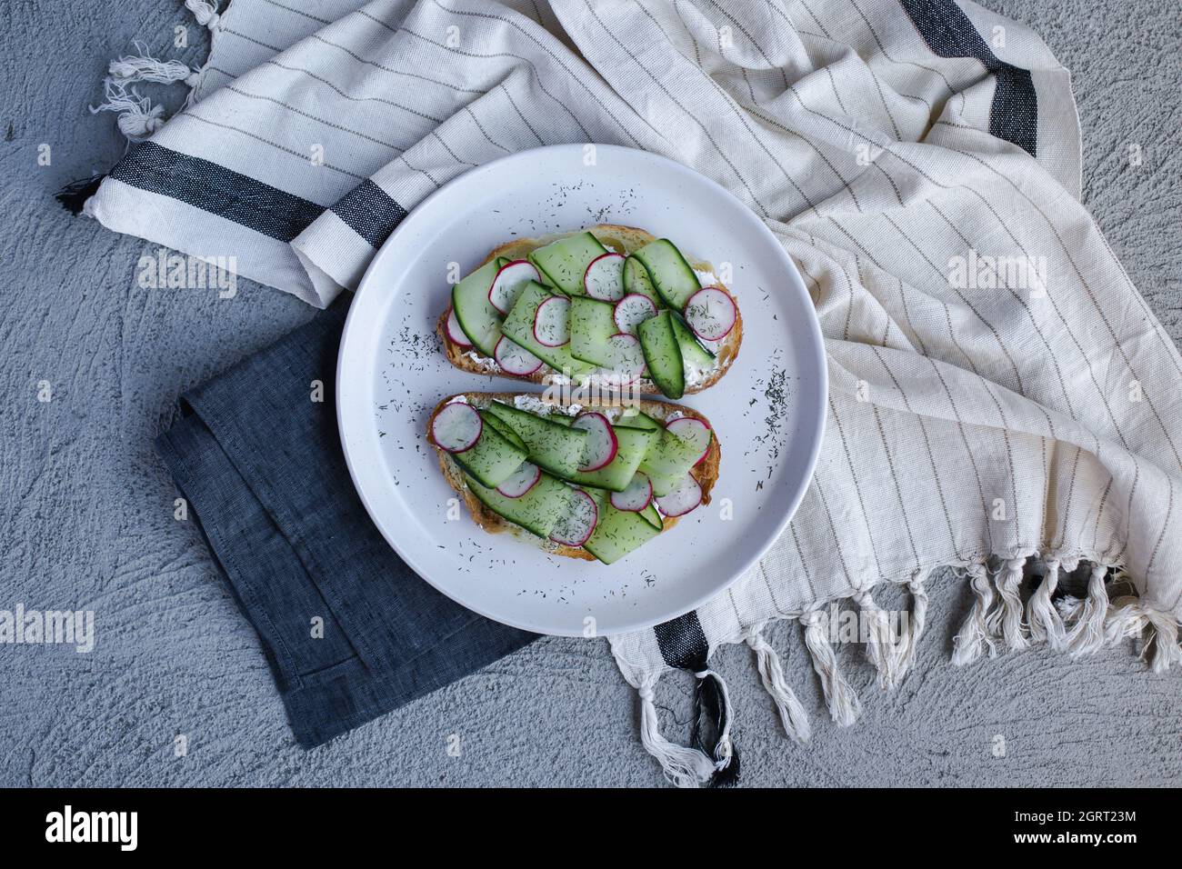 colorful and delicious plate, a toast with cucumber cream cheese Stock