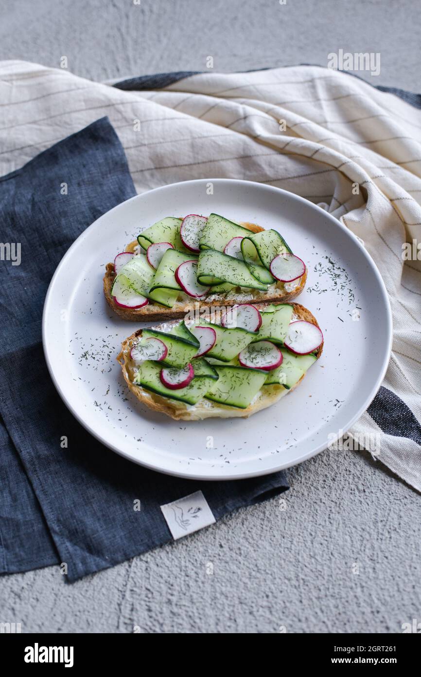 colorful and delicious plate, a toast with cucumber cream cheese Stock