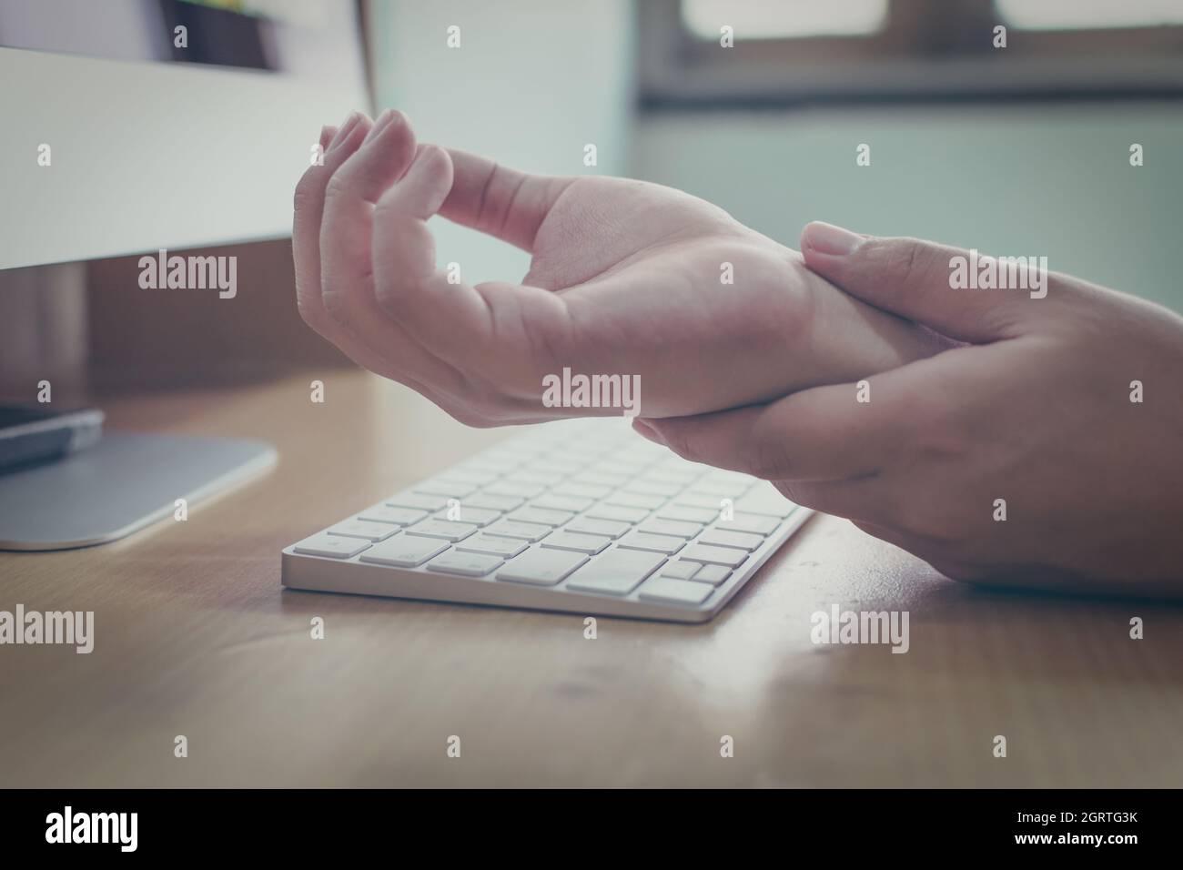 Hand Of Man Wrist Injury Of His Own Working Computer. Office Syndrome