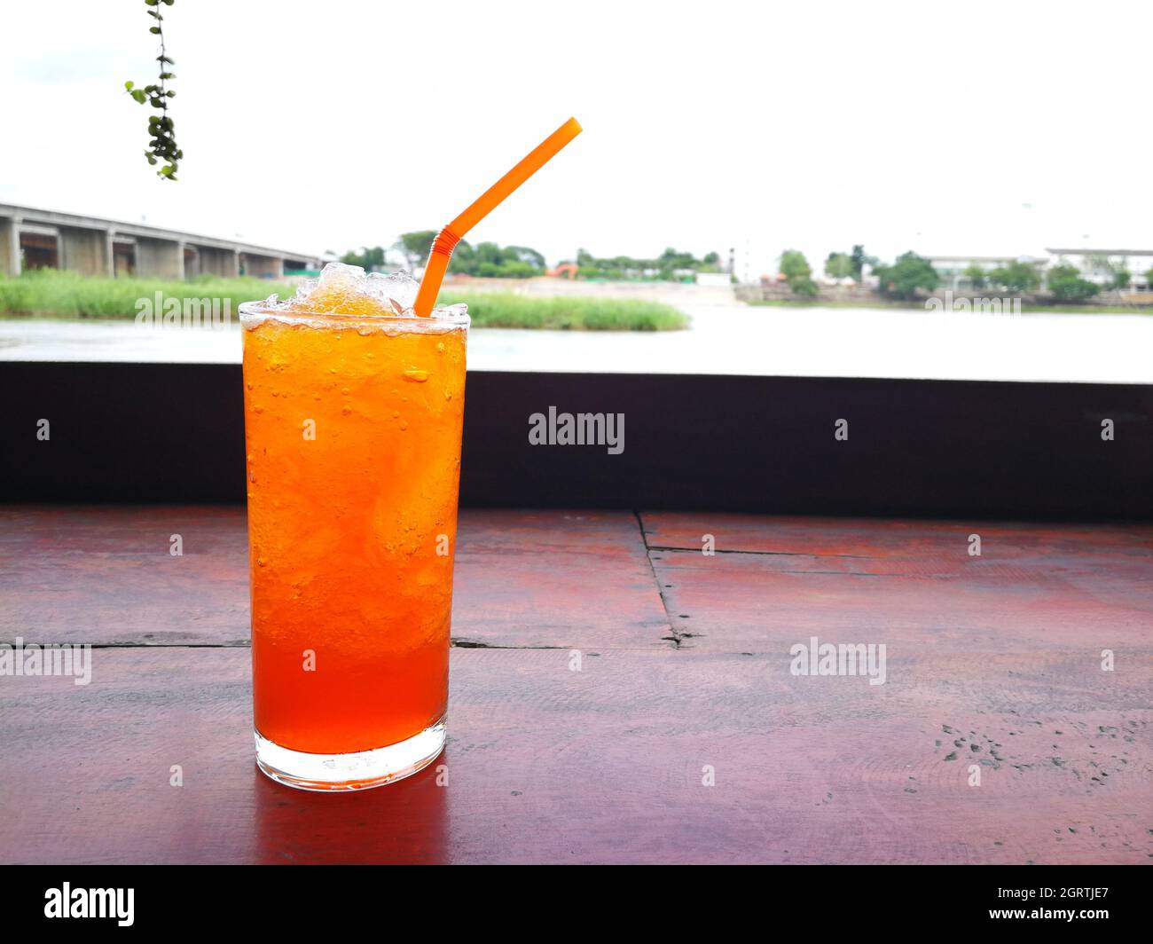 Close-up Of Drink On Table With Lake In Background Stock Photo