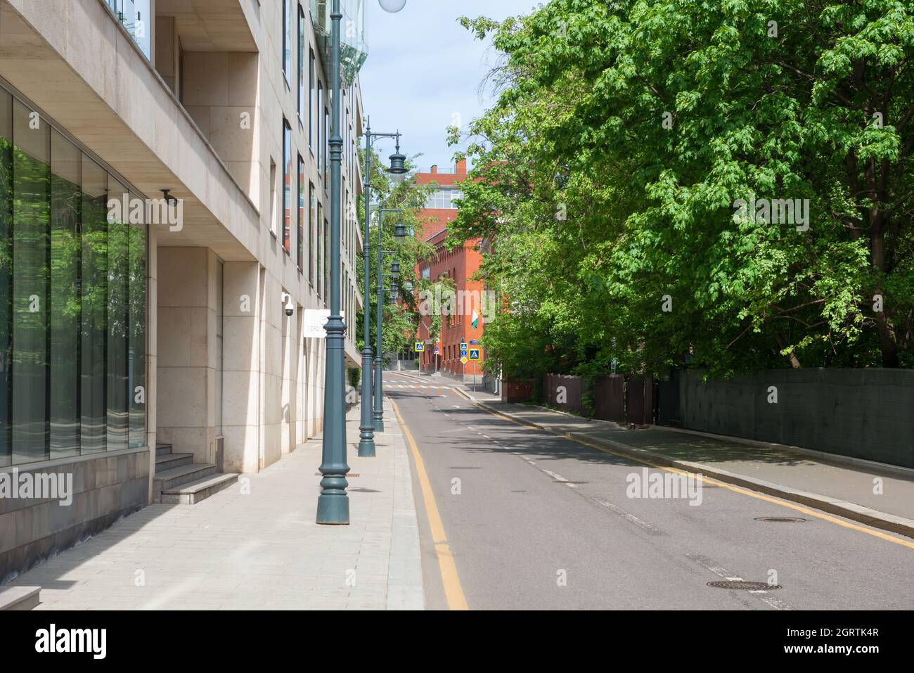 Moscow, Russia - May 23, 2021: Empty Korobeynikov lane. There are no cars on the highway, no people on the sidewalks Stock Photo