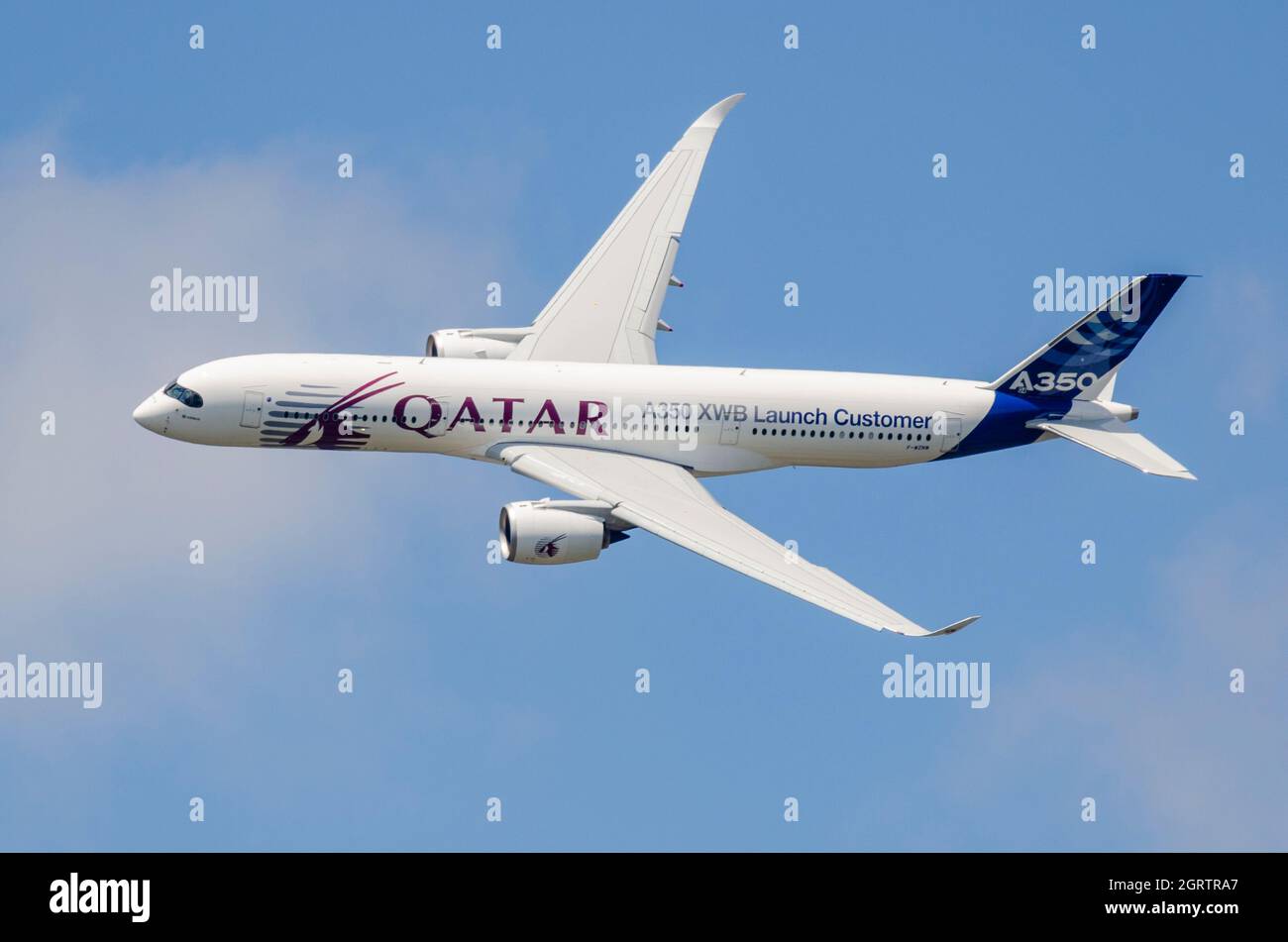 Airbus A350 jet airliner plane making the brand new type's public debut at Farnborough 2014 in Qatar livery. XWB (extra wide body) launch customer Stock Photo