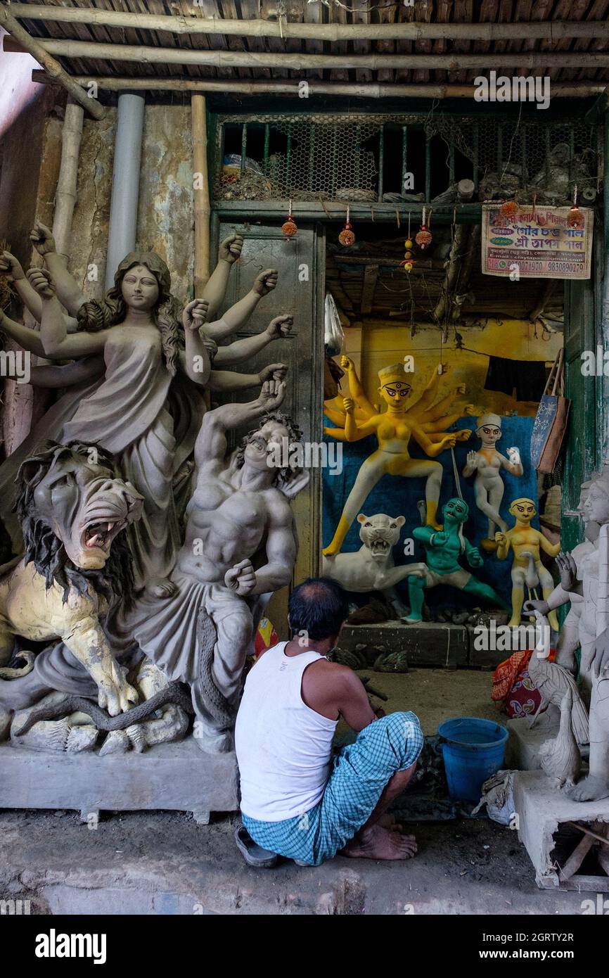 An Artist Seen Busy Making Final Touches To An Idol Of Maa Durga In His An Artist Seen Busy Making Final Touches To An Idol Of Maa Durga In His