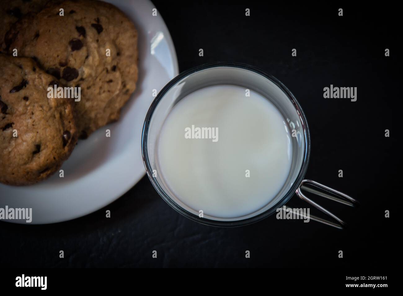 Close-up Of Milk And A Plate With Chocolate Cookies Stock Photo
