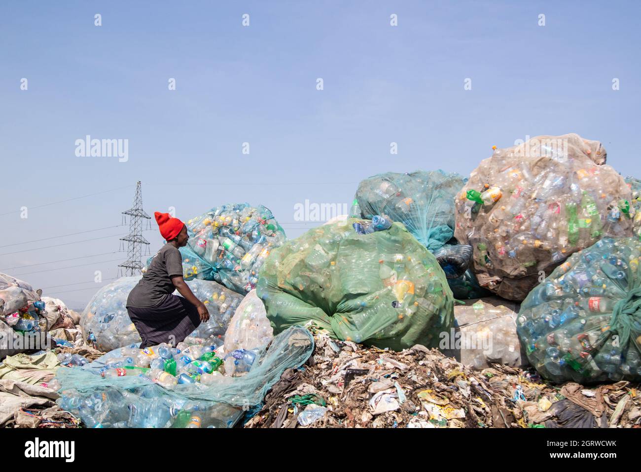 Nakuru, Kenya. 01st Oct, 2021. A woman is seen sorting plastic bottles waste at Gioto Dumping