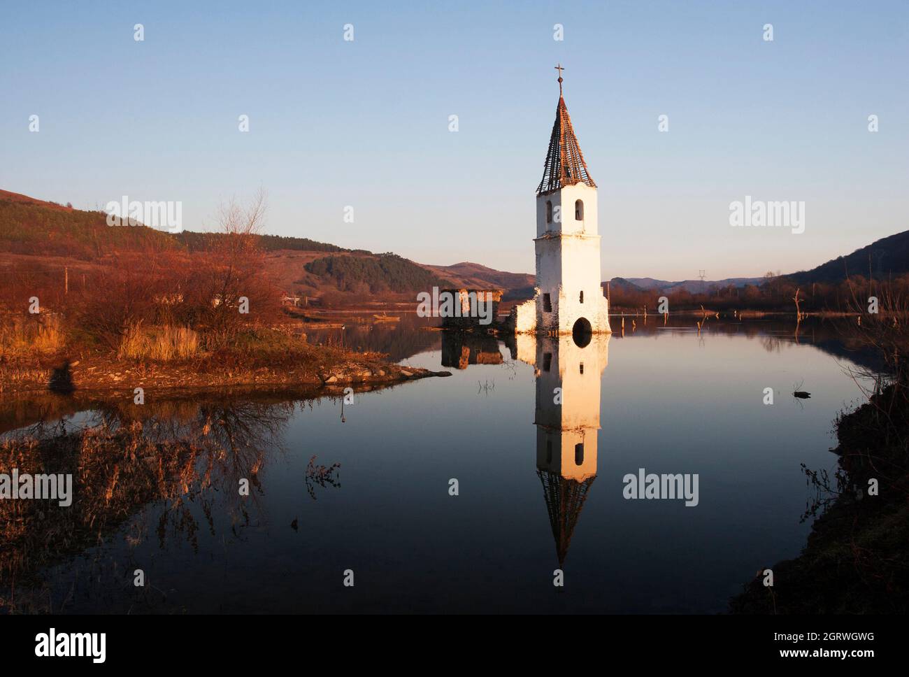 The ruins of a catholic church on the surface of Lake Bezid, the artificial dam that flooded the town. The church collapsed in 2014. Stock Photo