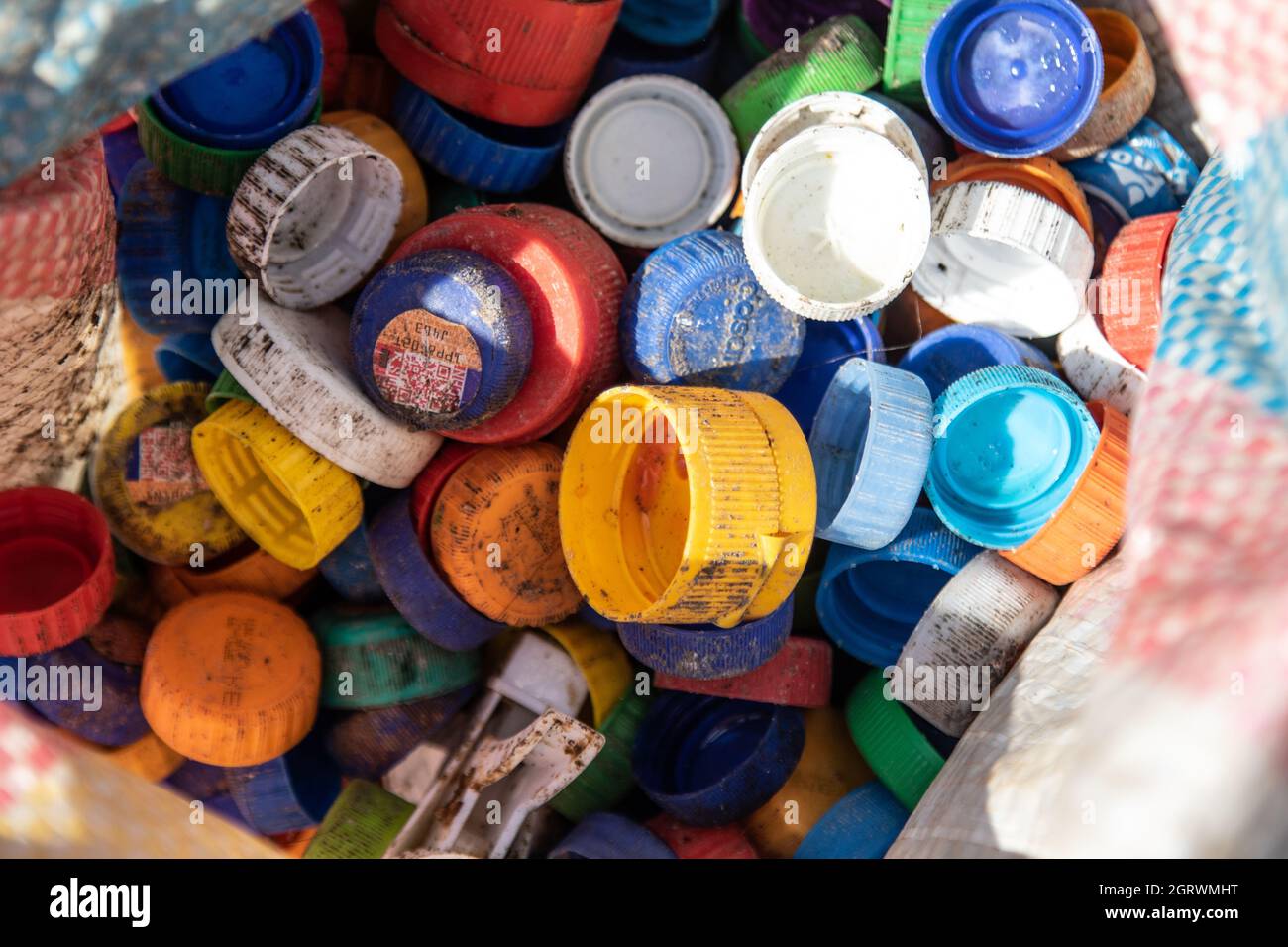 https://c8.alamy.com/comp/2GRWMHT/a-view-of-plastic-bottle-caps-sorted-for-recyclingthe-growing-problem-of-plastic-waste-ending-up-in-the-environment-is-becoming-a-concern-and-environmentalists-are-calling-for-more-investments-in-the-infrastructure-to-recycle-plastic-to-promote-circular-economy-and-reduce-plastic-pollution-they-are-also-asking-the-government-to-introduce-a-mandatory-bottle-deposit-and-refund-scheme-drs-which-will-give-value-to-plastic-drink-bottles-commonly-known-as-pet-polyethylene-terephthalate-deposit-refund-scheme-is-a-system-where-consumers-pay-a-small-amount-of-money-upfront-called-a-deposit-to-b-2GRWMHT.jpg