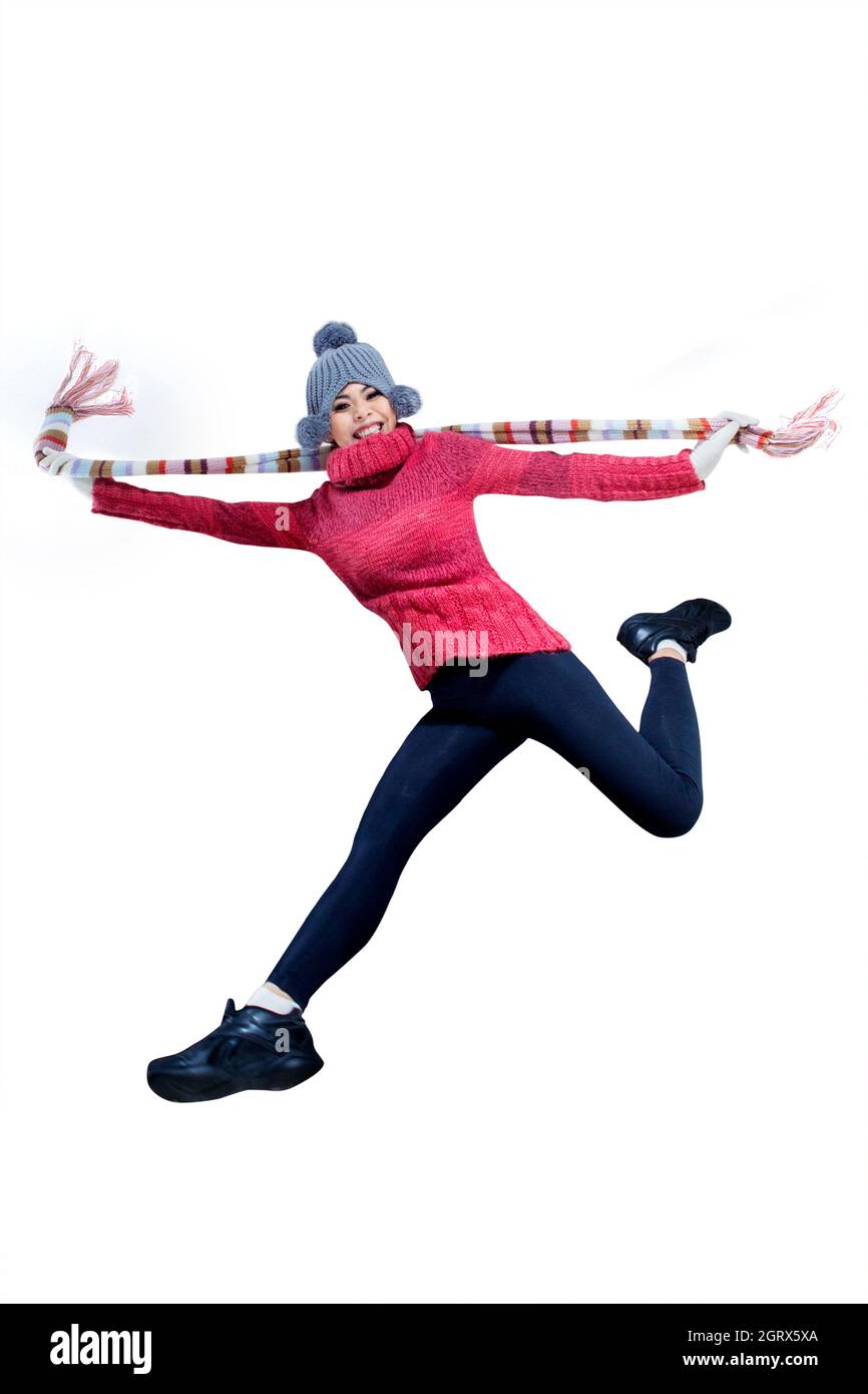 Portrait Of Happy Woman Jumping Against White Background Stock Photo