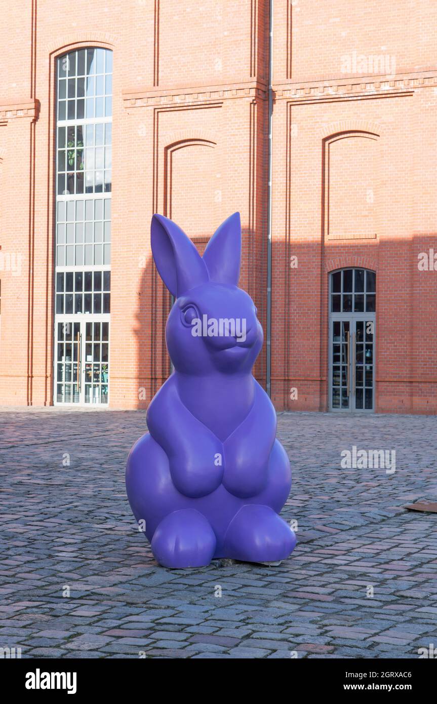 POZNAN, POLAND - Mar 08, 2015: A large purple Easter rabbit figure near a Stary Browar shopping mall Stock Photo