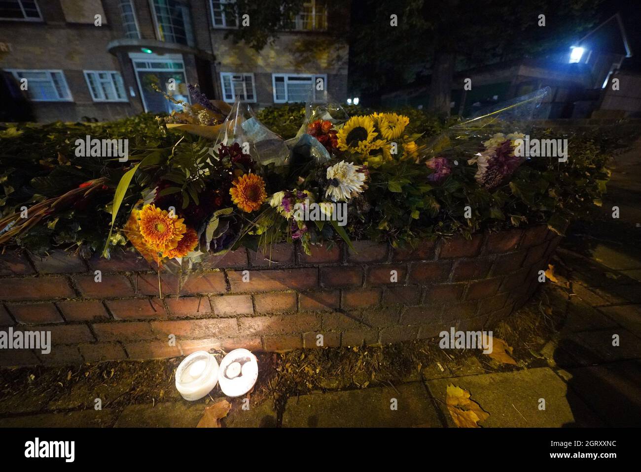 Floral tributes to Sarah Everard are left on Poynders Road in Clapham, south London, close to where Sarah Everard was abducted from the street by being falsely arrested by police officer Wayne Couzens in March. Picture date: Friday October 1, 2021. Stock Photo