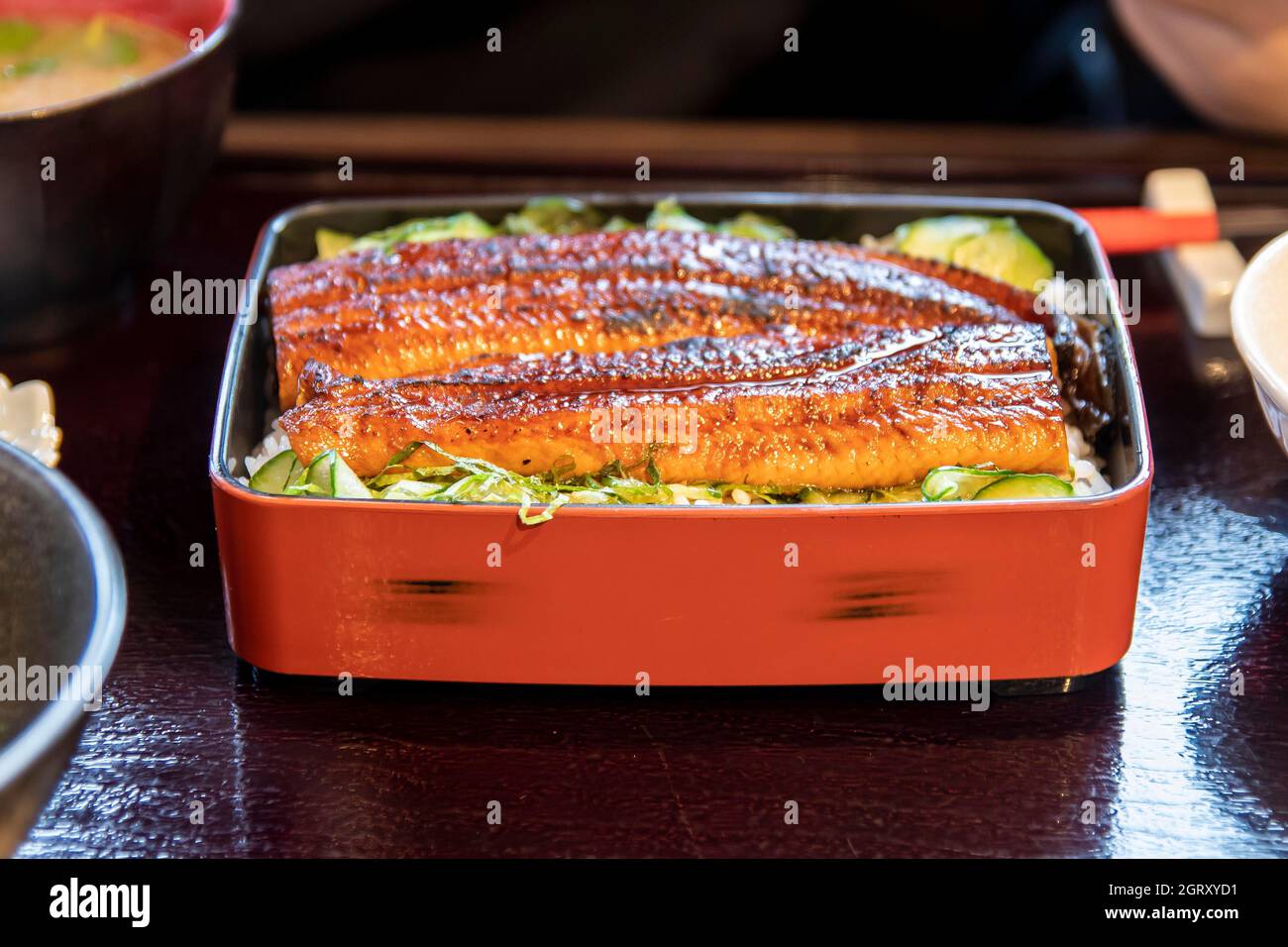 Close-up Of Barbecued Eel Rice Bowl Served On Table Stock Photo