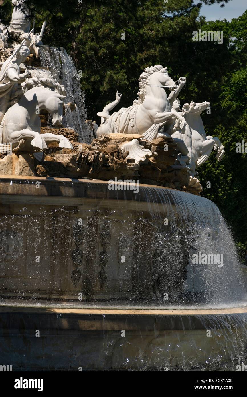 31 May 2019 - Vienna, Austria - Neptunbrunnen (Neptune fountain) at Schonbrunn palace. Sunny springtime day Stock Photo