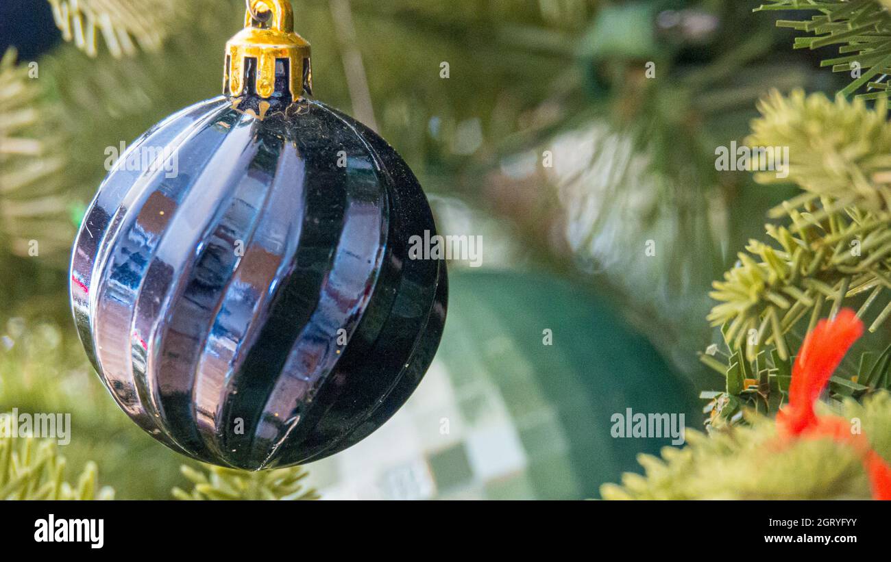Close-up Of Christmas Decorations Hanging On Glass Stock Photo