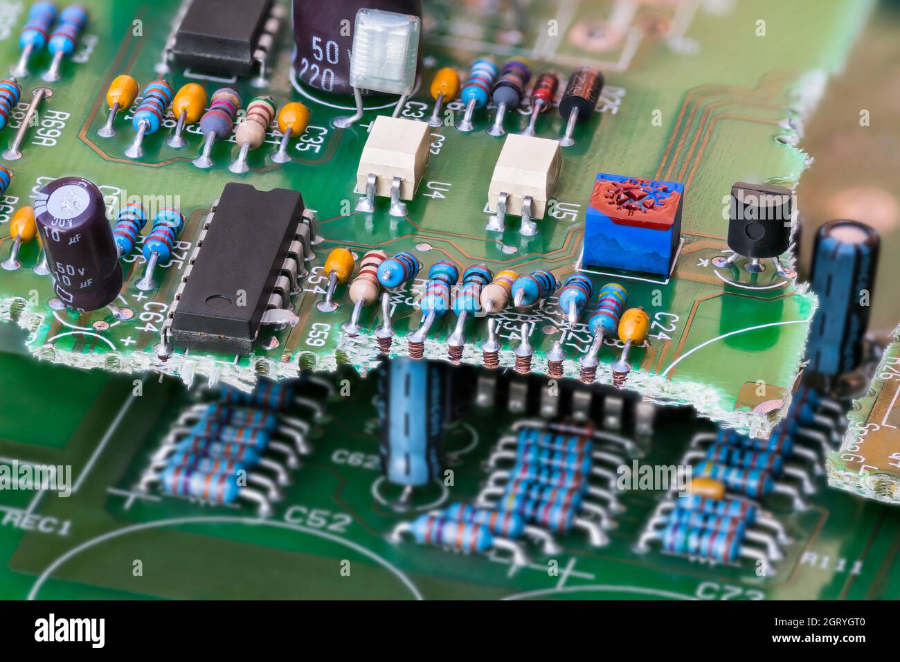 Closeup of electronic waste of broken green printed circuit board with