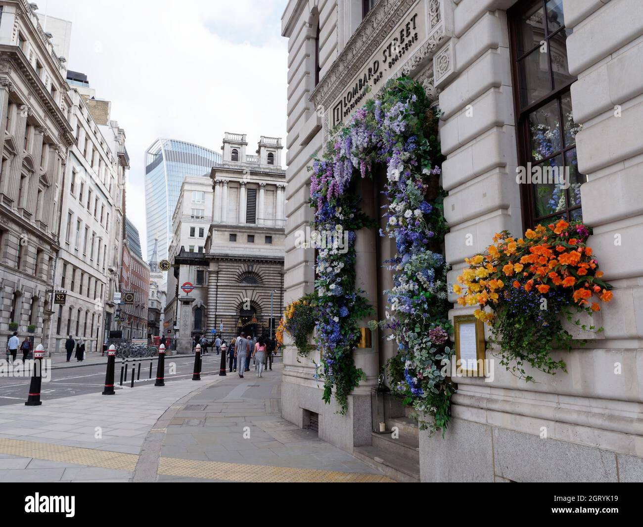 London, Greater London, England, September 21 2021: Brasserie covered with flowers with Bank Underground station and Walkie Talkie Skyscraper behind. Stock Photo