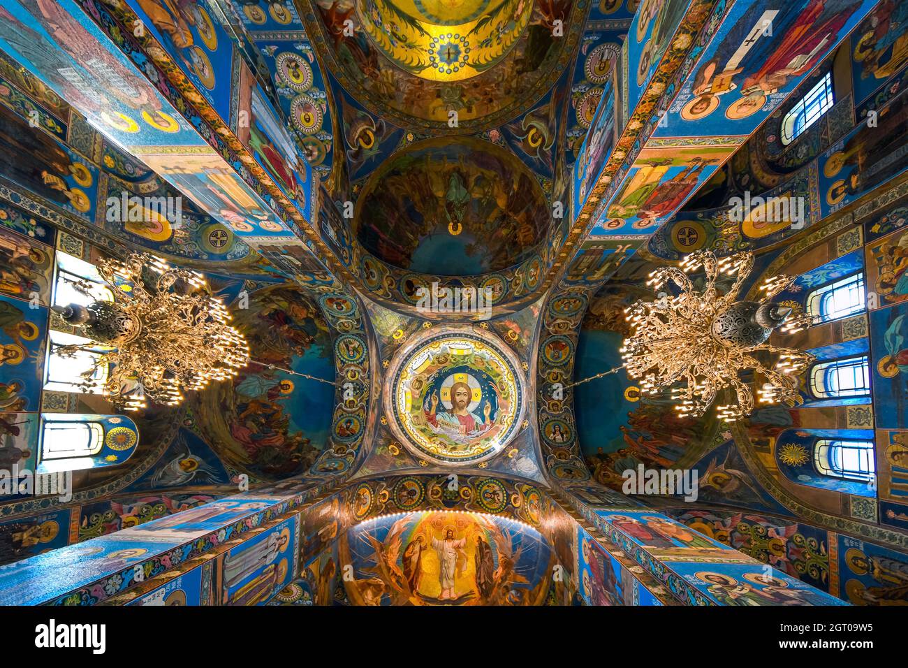 The ceiling, columns and walls covered in mosaics depicting religious scenes inside the Church of Our Savior on Spilled Blood, Saint Petersburg Russia Stock Photo
