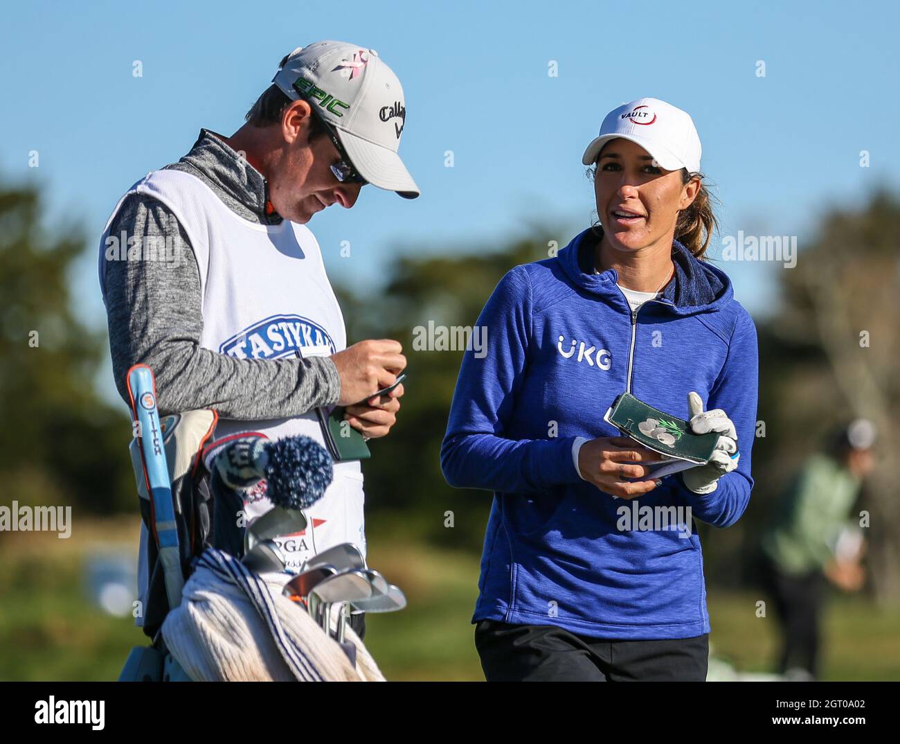 Jaye Marie Green of the United States talks strategy with her caddy during ...