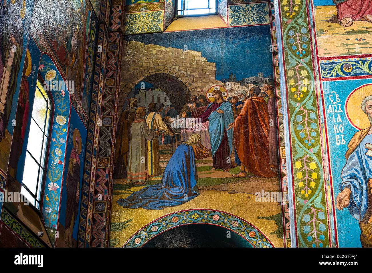 Biblical scenes in gold and blue mosaics inside the Church of Our Savior on Spilled Blood in Saint Petersburg, Russia. Stock Photo