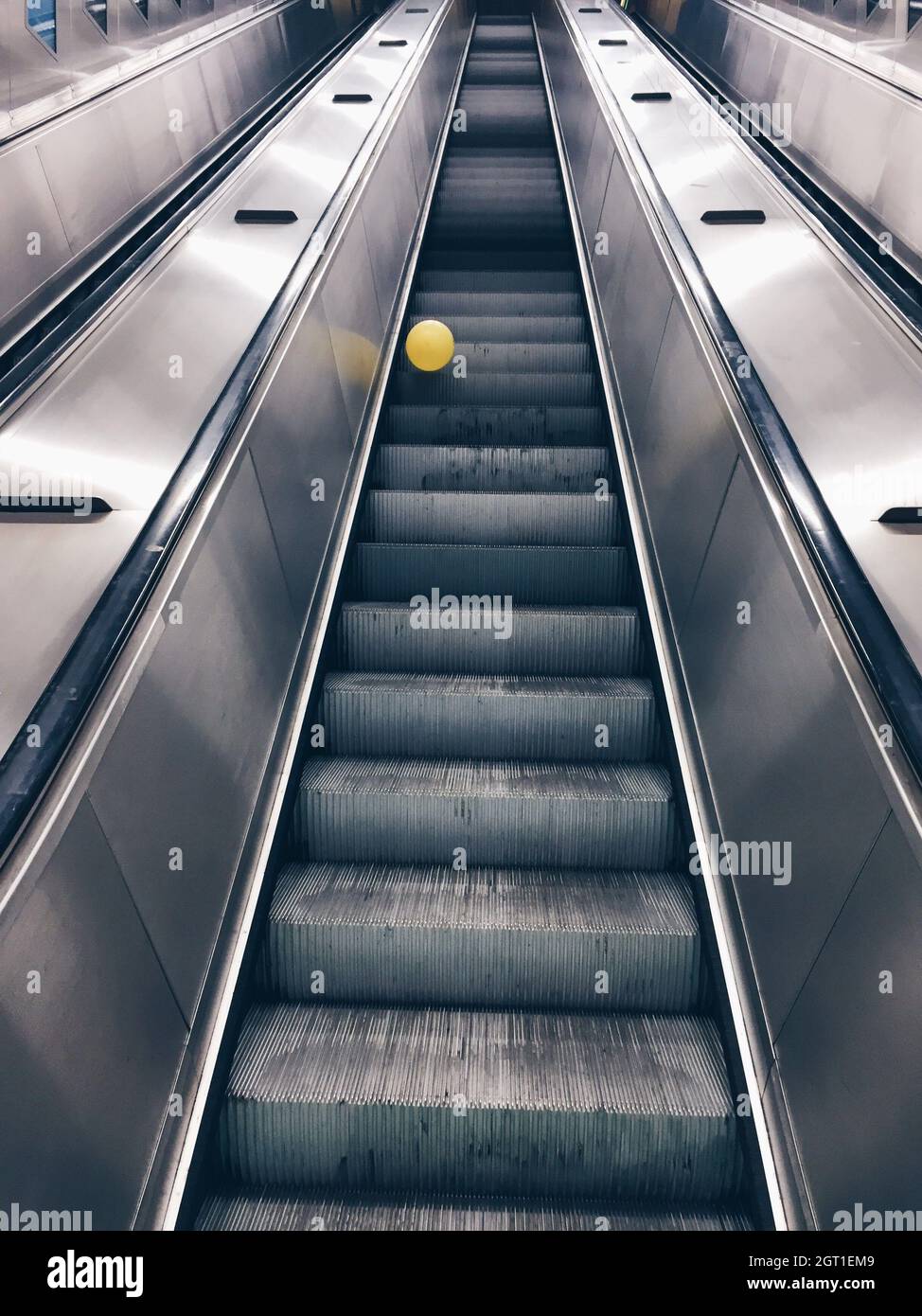 Exploring The Void, Metallic Structure, Escalator, Lonely Balloon, Conceptual, No People, Going Up Stock Photo