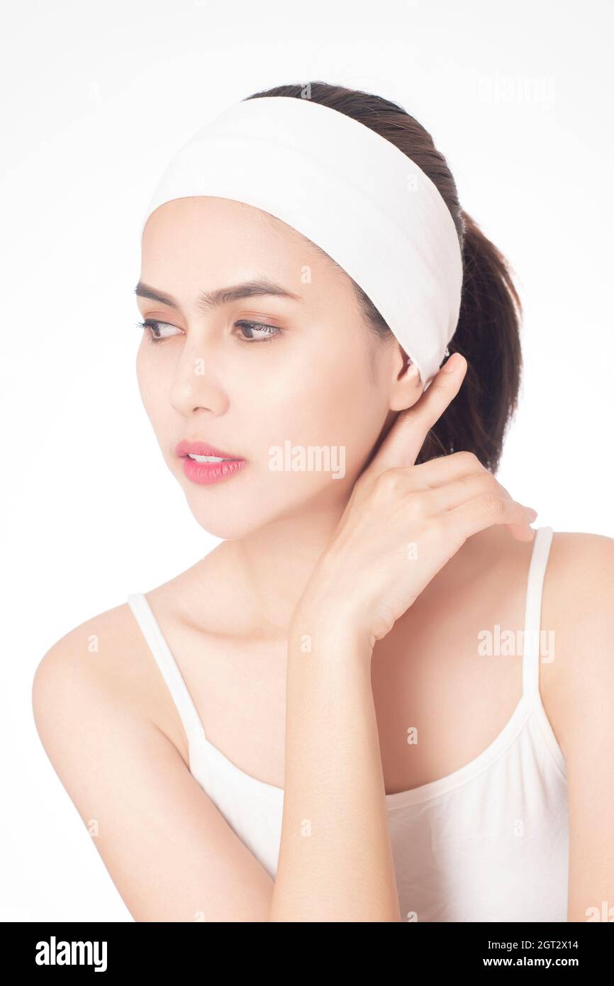 Young Woman Wearing Headband Over White Background Stock Photo