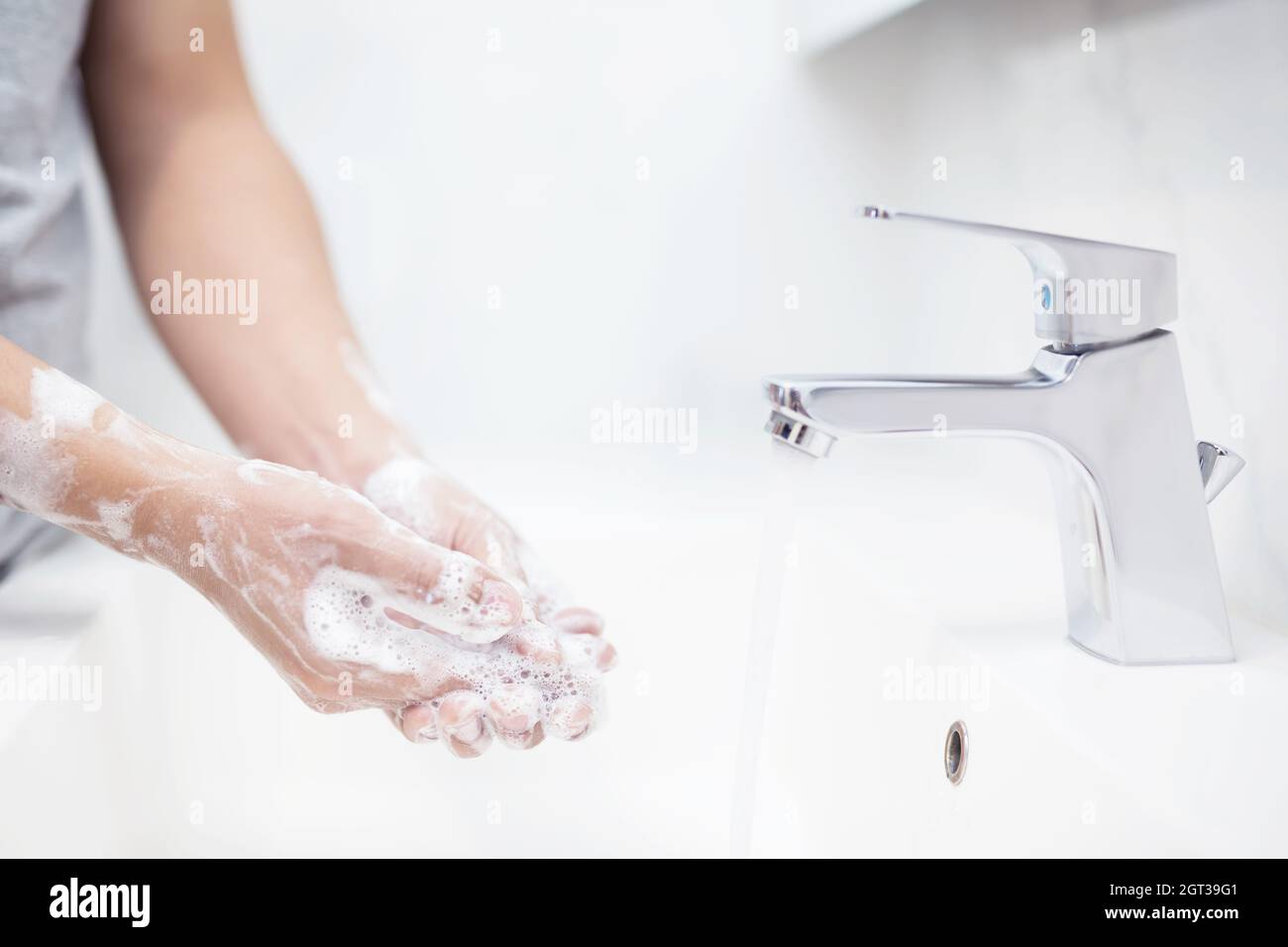 Men Are Washing Their Hands Before Eating Food Every Time To Prevent The Virus. Stock Photo