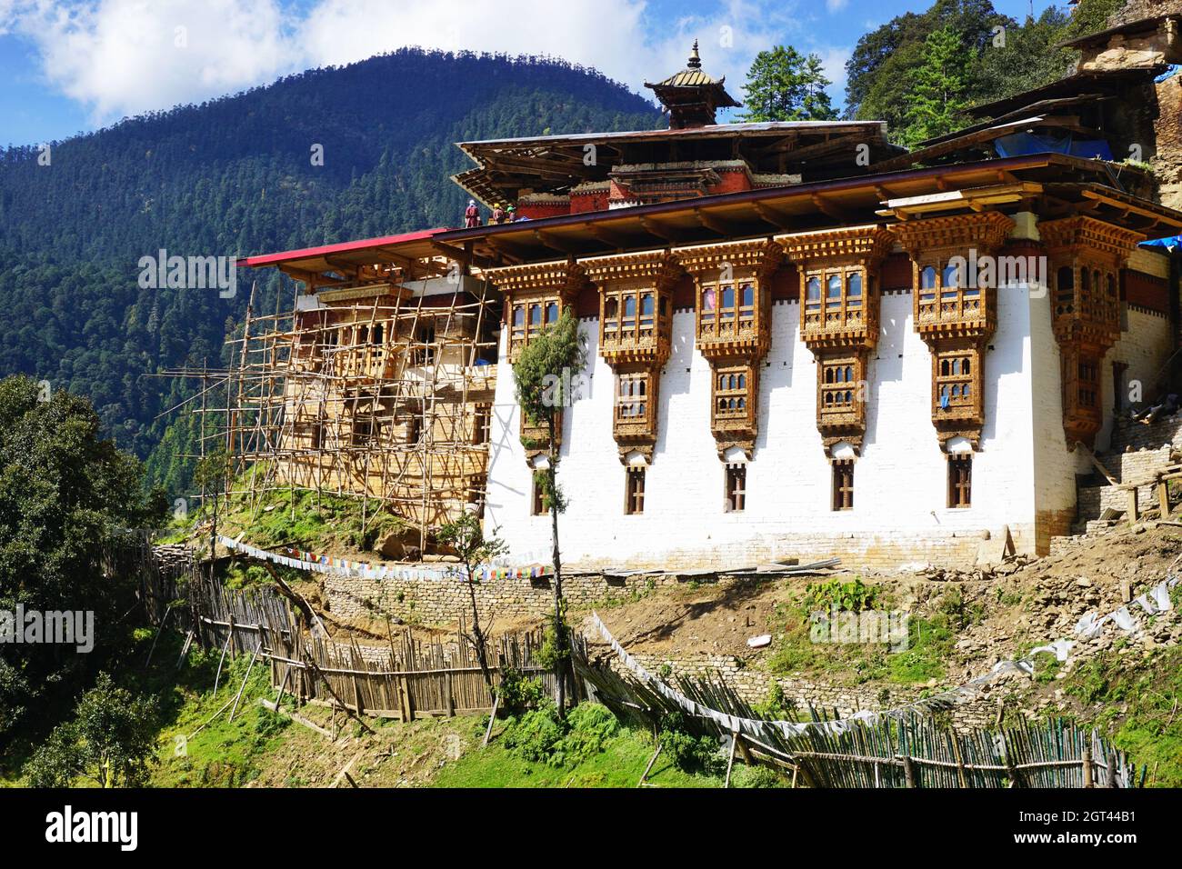 Bhutan’s Chagri Dorjeden Monastery, also called Cheri Dorji Dhen, with scaffolding in place for extensive repairs due to damage from a landslide. Stock Photo