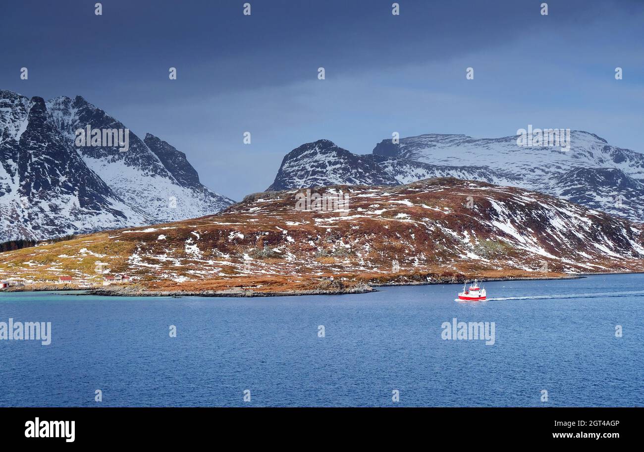Scenic View Of Ship In Sea Against Mountain Range Stock Photo