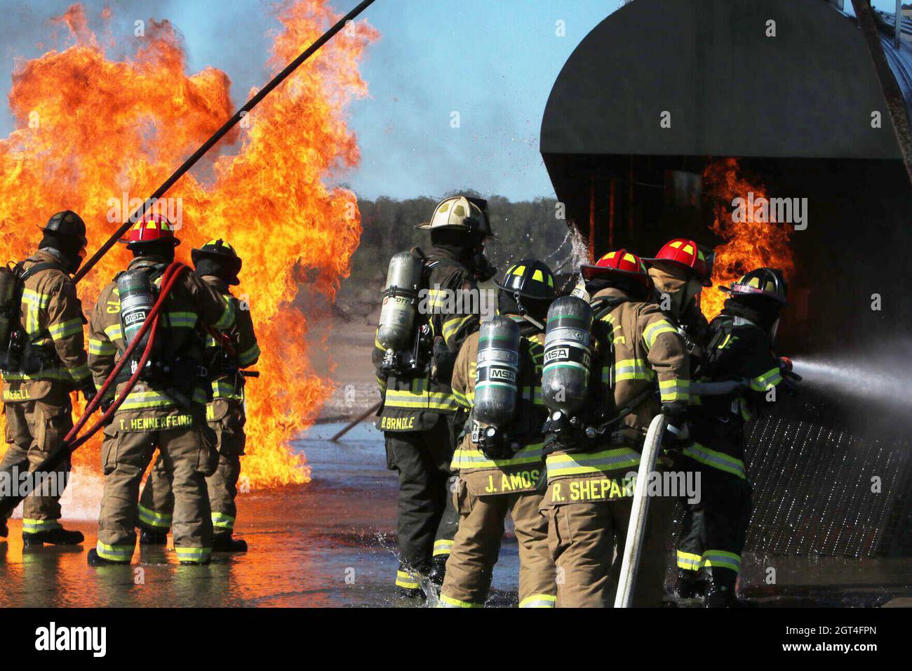 Middle Tennessee firefighters work together to extinguish both interior and exterior aircraft fires during an International Fire Service Accreditation Congress Airport Firefighter course hosted Sept. 20-24 at Fort Campbell. Fort Campbell Fire and Emergency Services partnered with the Tennessee State Fire Commission to help approximately 14 firefighters earn their Airport Firefighter certification through the 40-hour program, which included classroom instruction and hands-on training. Stock Photo