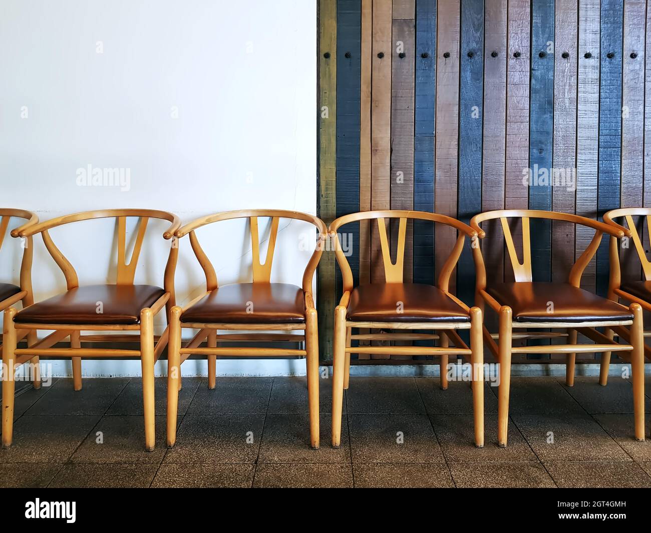 Empty Chairs Against Wall In Building Stock Photo Alamy