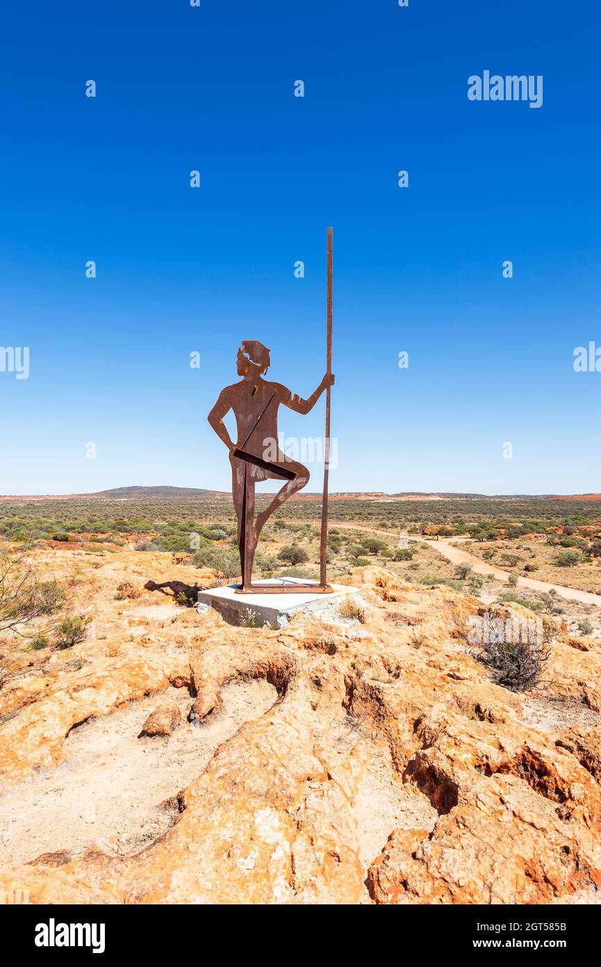 Vertical view of a metal statue of an Aborigine, the Granites Nature