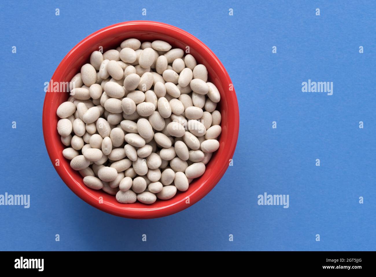 Uncooked Navy Beans In A Bowl Stock Photo