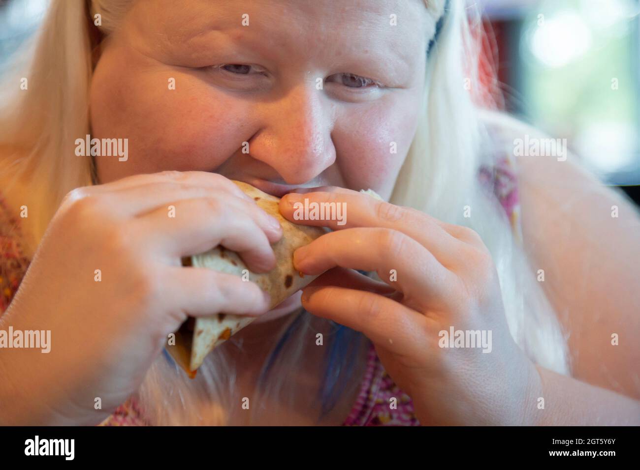 Close-up Of Woman Eating Food Stock Photo