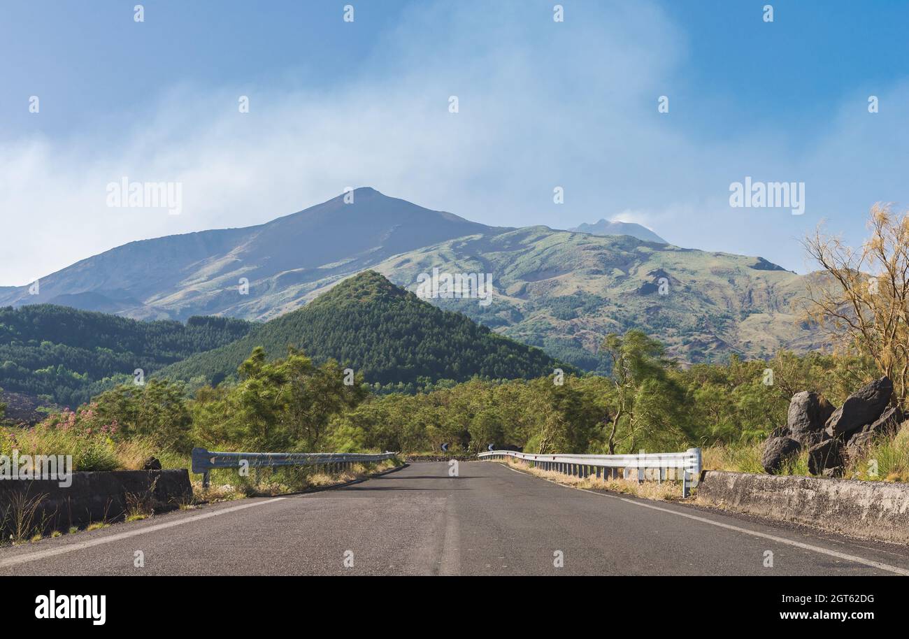 Road On The South Side Of Mount Etna, With Central Crater On Background Stock Photo