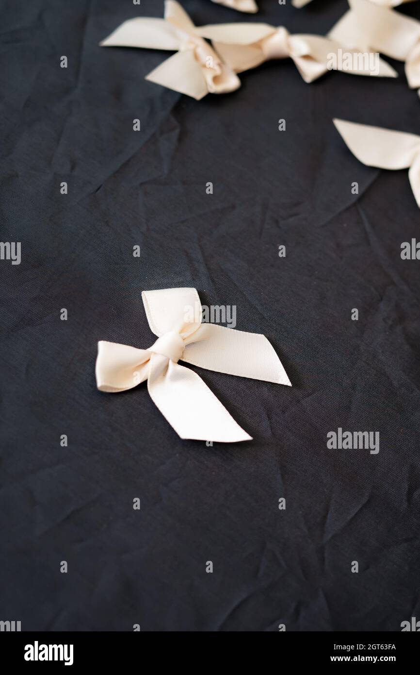 White Silk Ribbons Isolated On The Black Background Stock Photo - Alamy