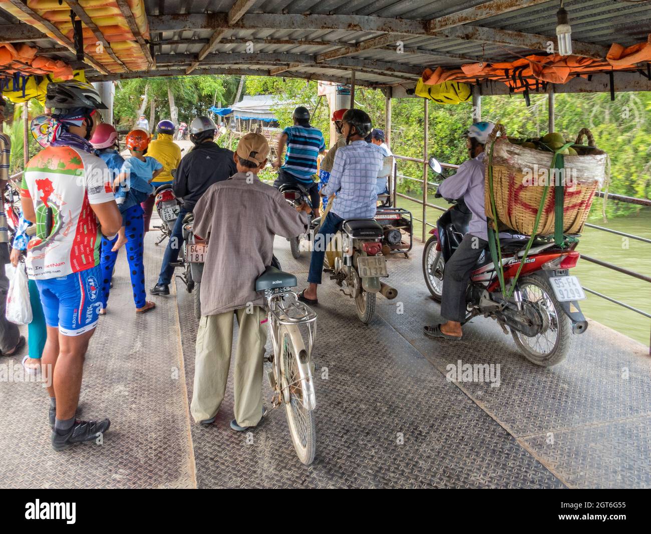 Passengers on a small Mekong River Delta ferry - Can Tho, Vietnam Stock ...