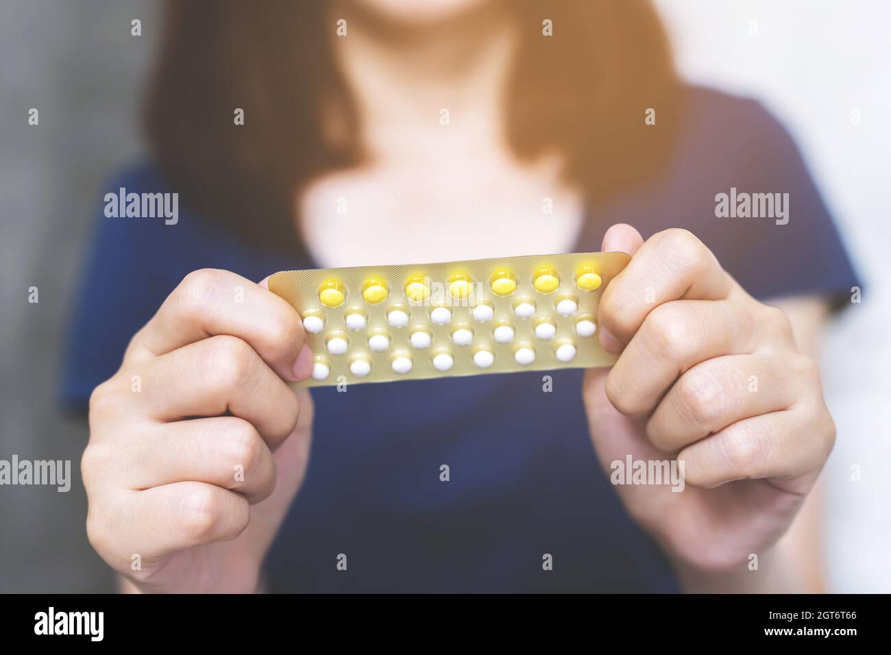 Women Take Birth Control Pills To Control Pregnancy Stock Photo