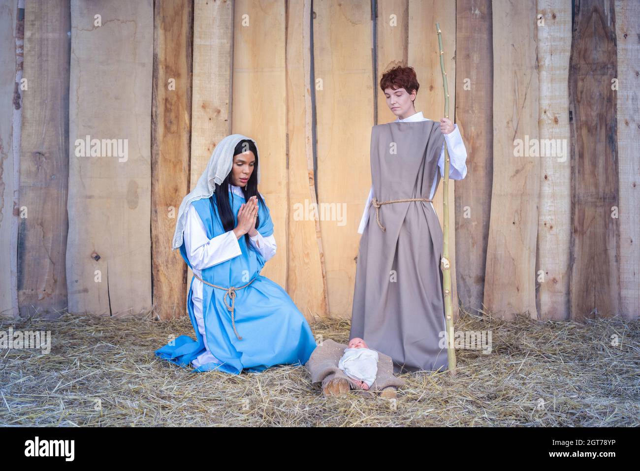 Christmas crib with two transgender people representing mary and joseph Stock Photo