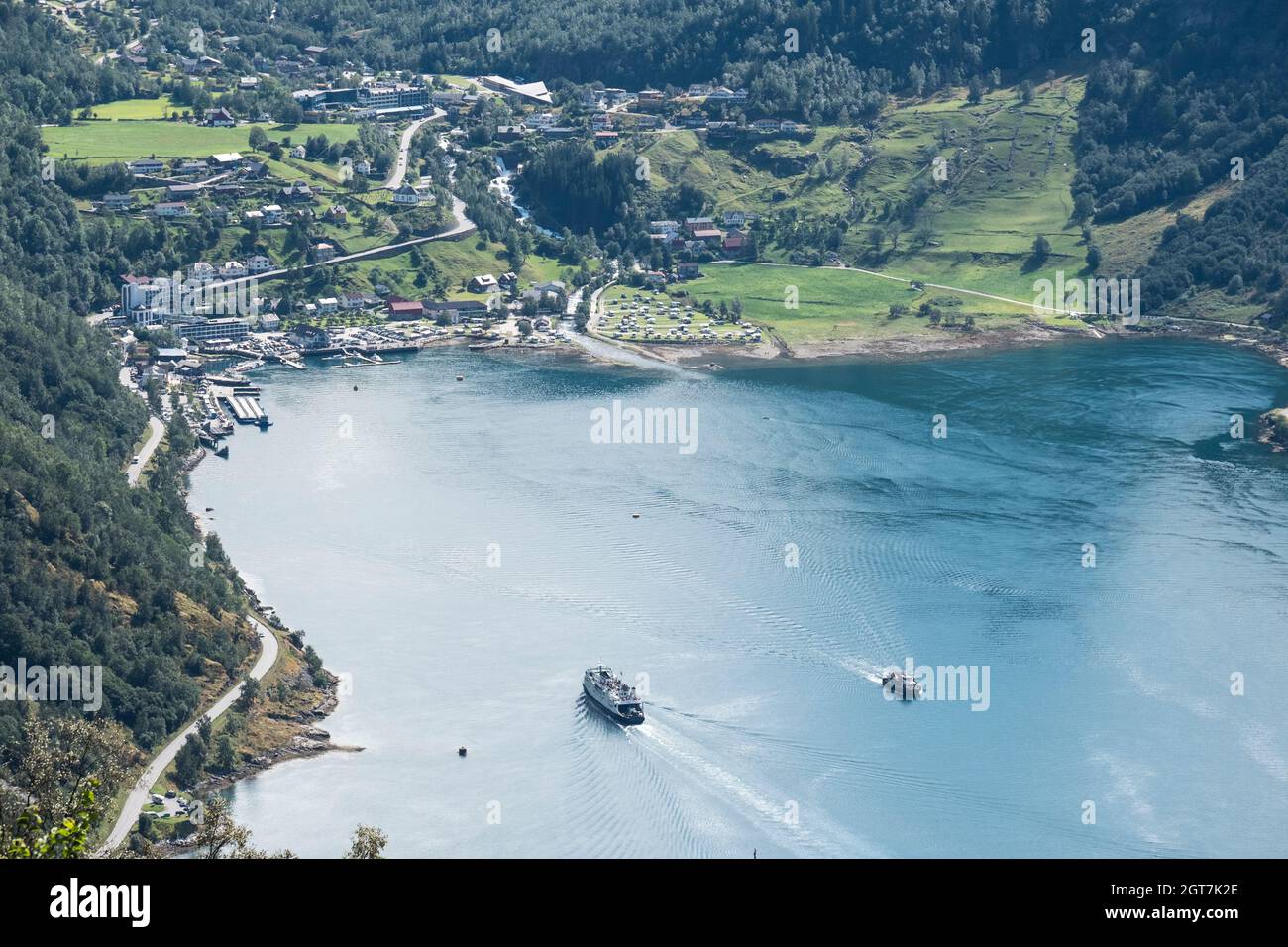 Aerial View At Town Of Geiranger On A Beauty Day In Summer With In And Out Comming Ships Stock Photo
