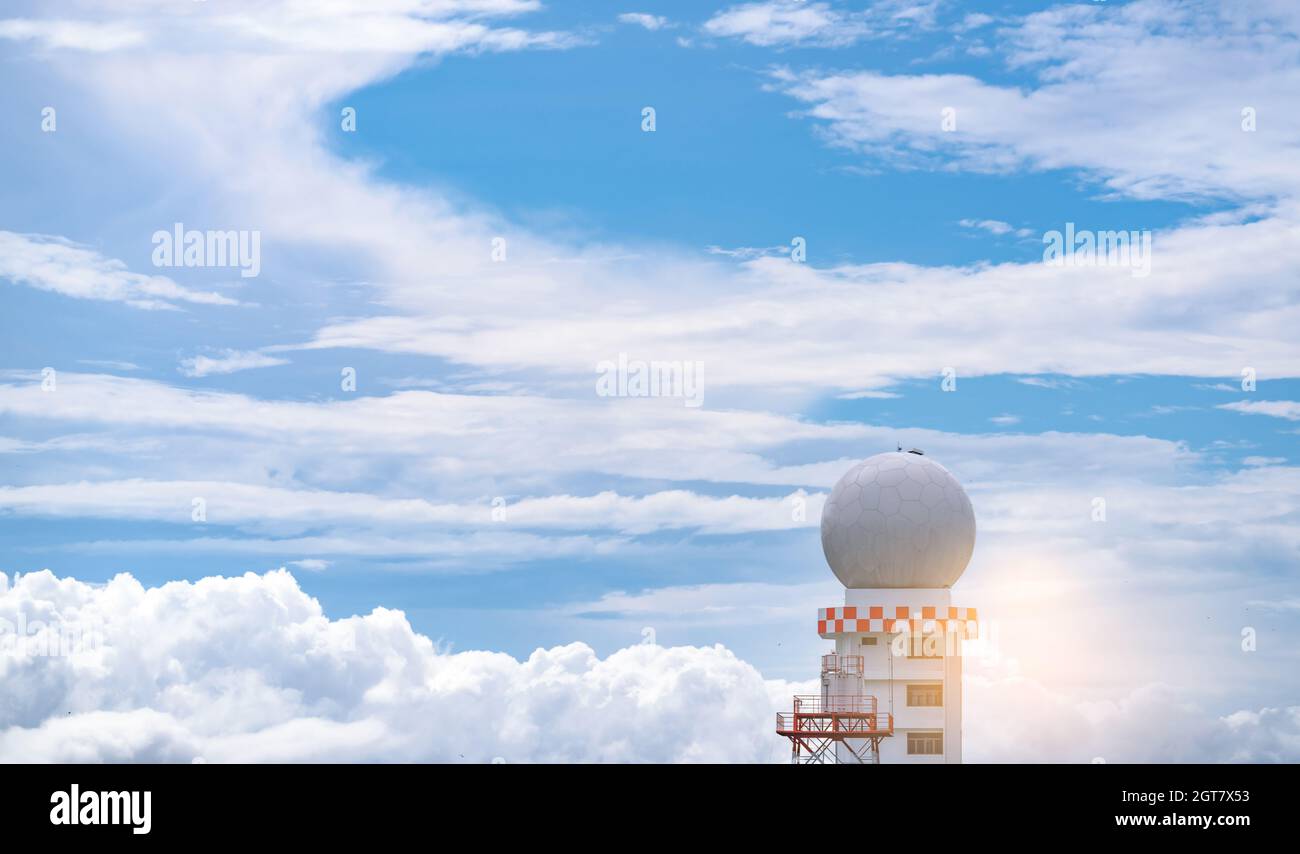 Weather Observations Radar Dome Station Against Blue Sky And White Clouds. Aeronautical. Stock Photo