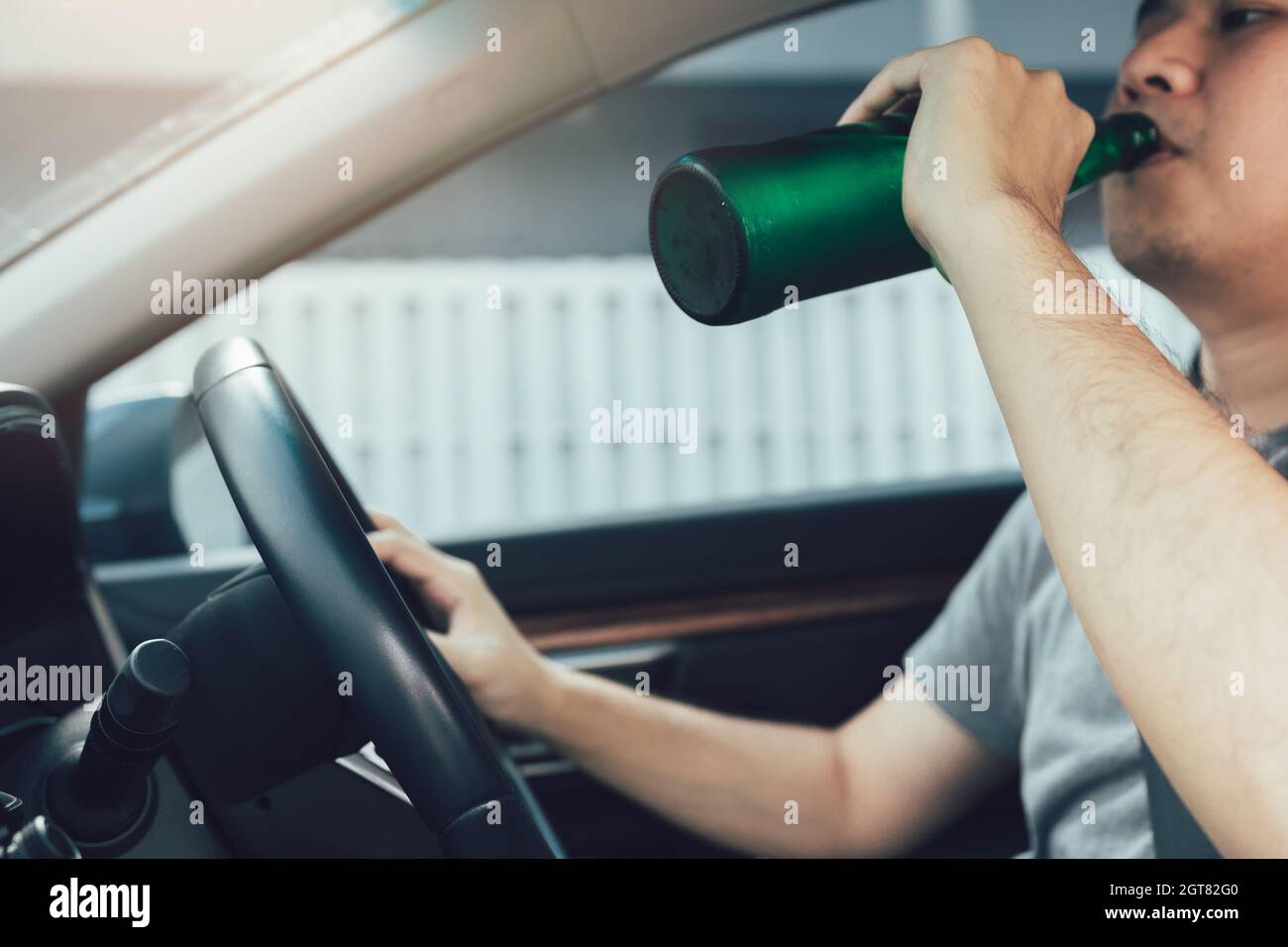 Man Drinking Beer While Driving Car Stock Photo Alamy