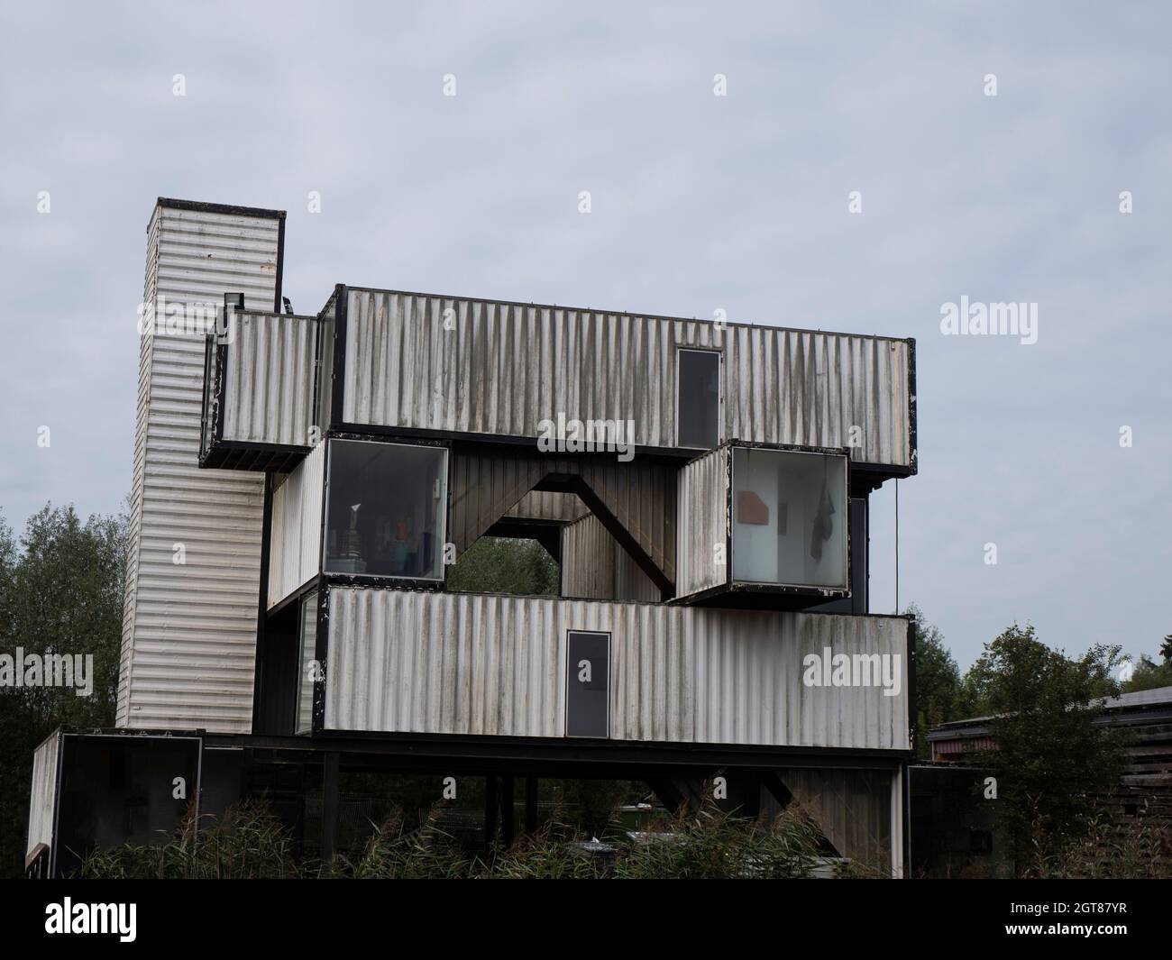 Stekene, Belgium, September 25, 2021, Stacked old shipping containers that serve as a residence Stock Photo