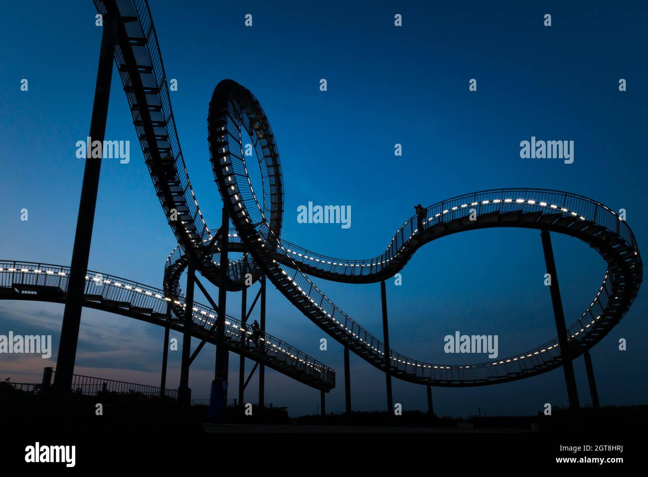 Fragment Of Walkable Tiger And Turtle Roller Coaster Sculpture On Magic Mountain At Night Stock Photo