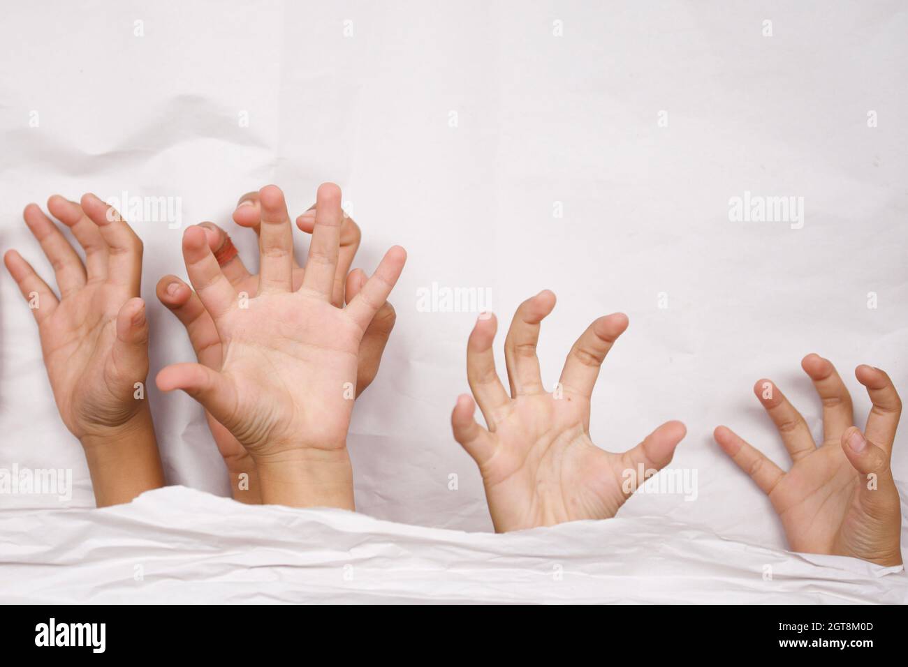 People Hands Over Blanket On Bed Stock Photo