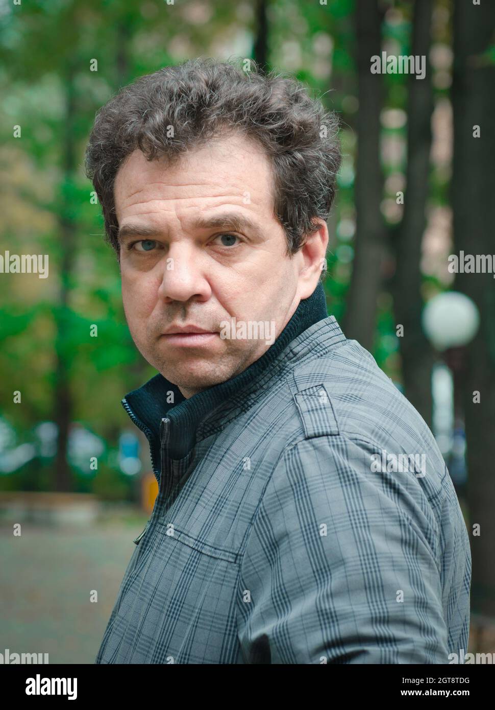 Portrait Of Man Standing Outdoors Stock Photo