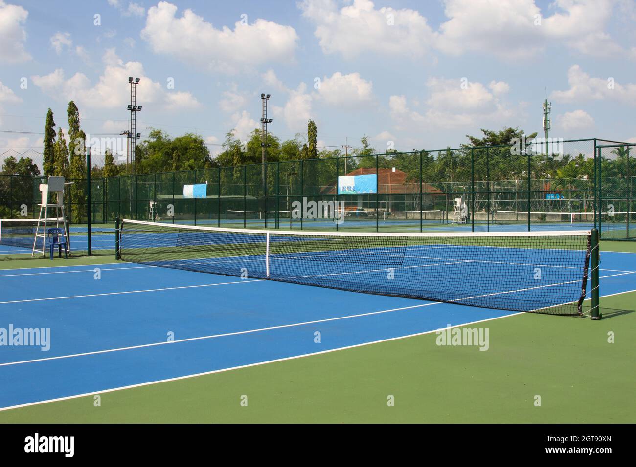 Tennis Court Outdoors With Net In Daylights Stock Photo
