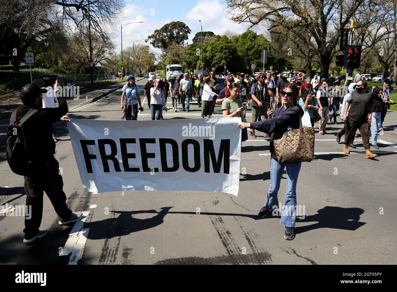 Melbourne, Australia, 2 October, 2021. Protesters march during the 'Rise Up! Melbourne Rally for Health Rights and Freedom' in The Royal Botanic Gardens. Melbourne continues its hard lockdowns following Premier Daniel Announcement that all authorized workers must be mandatorily vaccinated by October 15. Credit: Dave Hewison/Speed Media/Alamy Live News Stock Photo