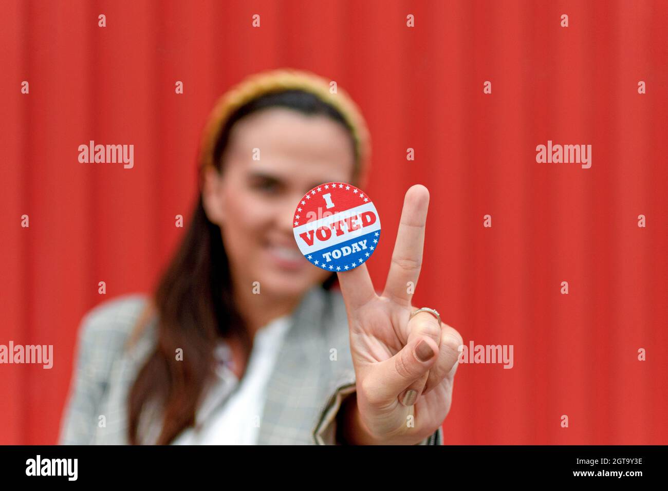 Selective Focus Of Woman Holding Voting Sticker, I Voted, Election, Vote. Stock Photo