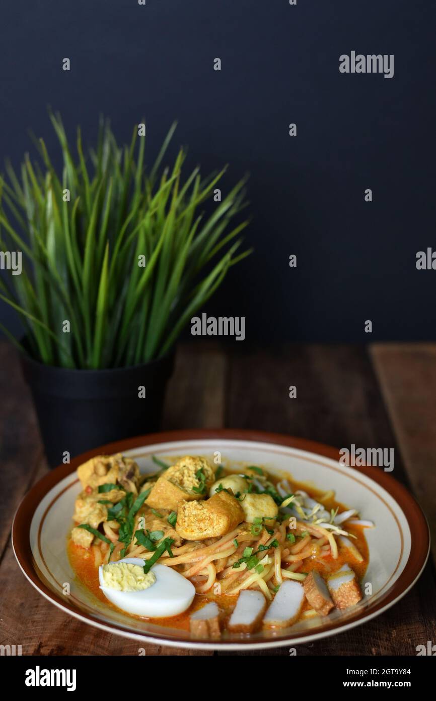 Curry noodle in a plate. Famous food called Mee Kari in malaysia 